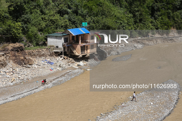 A house sustains damage from flooding in Kavrepalanchowk District along the BP Highway of Nepal, on October 1, 2024. 