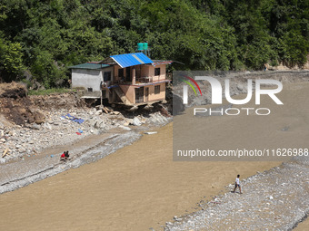 A house sustains damage from flooding in Kavrepalanchowk District along the BP Highway of Nepal, on October 1, 2024. (