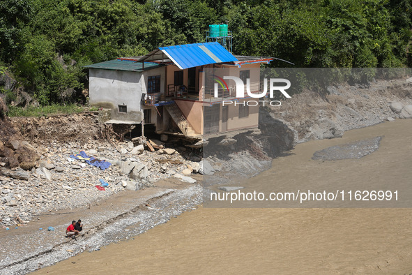 A house sustains damage from flooding in Kavrepalanchowk District along the BP Highway of Nepal, on October 1, 2024. 