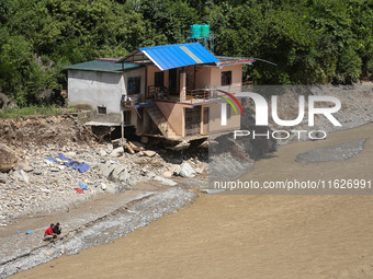 A house sustains damage from flooding in Kavrepalanchowk District along the BP Highway of Nepal, on October 1, 2024. (