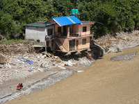 A house sustains damage from flooding in Kavrepalanchowk District along the BP Highway of Nepal, on October 1, 2024. (