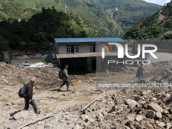 A house sustains damage from flooding in Kavrepalanchowk District along the BP Highway of Nepal, on October 1, 2024. (