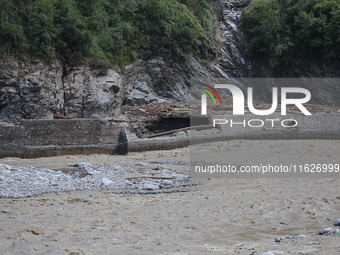 A section of BP Highway, a major highway that connects Kathmandu directly with the Southern Plains of Nepal, is damaged by a landslide in Ka...