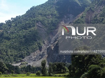 A section of BP Highway, a major highway that connects Kathmandu directly with the Southern Plains of Nepal, is damaged by a landslide in Ka...