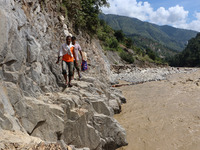 Nepali passengers traveling through the BP Highway, a major highway that connects Kathmandu directly with the Southern Plains of Nepal, make...