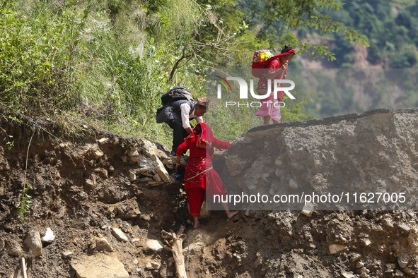 Nepali passengers traveling through the BP Highway, a major highway that connects Kathmandu directly with the Southern Plains of Nepal, make...