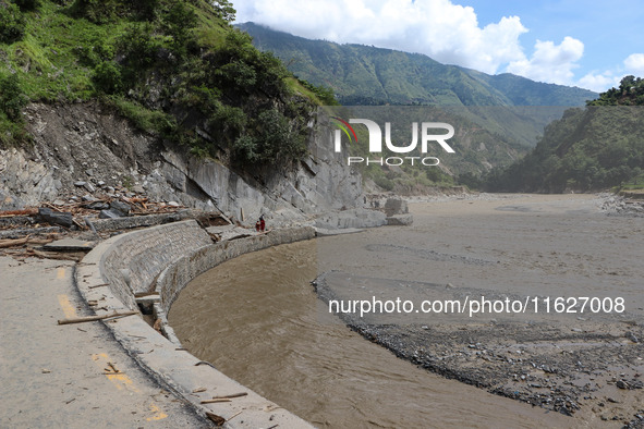 A section of BP Highway, a major highway that connects Kathmandu directly with the Southern Plains of Nepal, is damaged by a landslide in Ka...