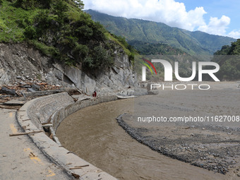 A section of BP Highway, a major highway that connects Kathmandu directly with the Southern Plains of Nepal, is damaged by a landslide in Ka...