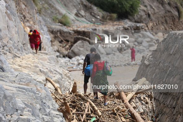 Nepali passengers traveling through the BP Highway, a major highway that connects Kathmandu directly with the Southern Plains of Nepal, make...