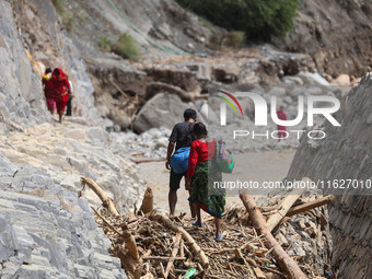 Nepali passengers traveling through the BP Highway, a major highway that connects Kathmandu directly with the Southern Plains of Nepal, make...