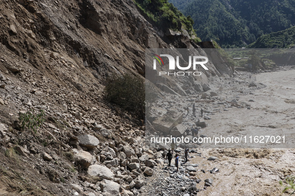 A section of BP Highway, a major highway that connects Kathmandu directly with the Southern Plains of Nepal, is damaged by a landslide in Ka...