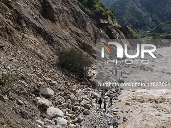 A section of BP Highway, a major highway that connects Kathmandu directly with the Southern Plains of Nepal, is damaged by a landslide in Ka...