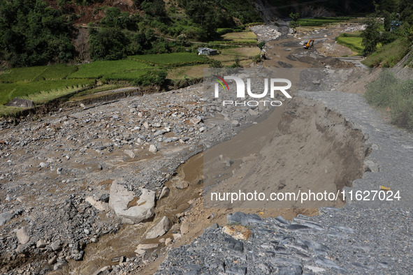 A section of BP Highway, a major highway that connects Kathmandu directly with the Southern Plains of Nepal, is damaged by a landslide in Ka...