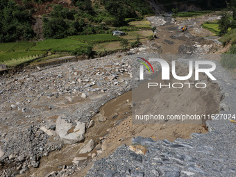 A section of BP Highway, a major highway that connects Kathmandu directly with the Southern Plains of Nepal, is damaged by a landslide in Ka...