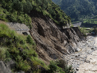 A section of BP Highway, a major highway that connects Kathmandu directly with the Southern Plains of Nepal, is damaged by a landslide in Ka...