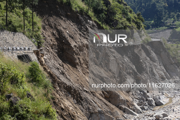 A section of BP Highway, a major highway that connects Kathmandu directly with the Southern Plains of Nepal, is damaged by a landslide in Ka...