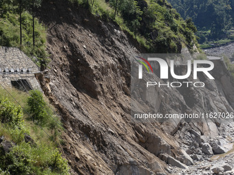 A section of BP Highway, a major highway that connects Kathmandu directly with the Southern Plains of Nepal, is damaged by a landslide in Ka...