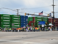 Longshoremen carry signs and demonstrate outside the APM terminals in Elizabeth, New Jersey, United States, on October 1, 2024, as members o...