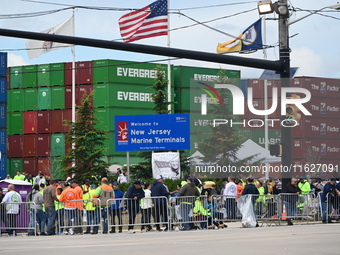 Longshoremen carry signs and demonstrate outside the APM terminals in Elizabeth, New Jersey, United States, on October 1, 2024, as members o...