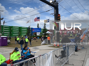 Longshoremen carry signs and demonstrate outside the APM terminals in Elizabeth, New Jersey, United States, on October 1, 2024, as members o...