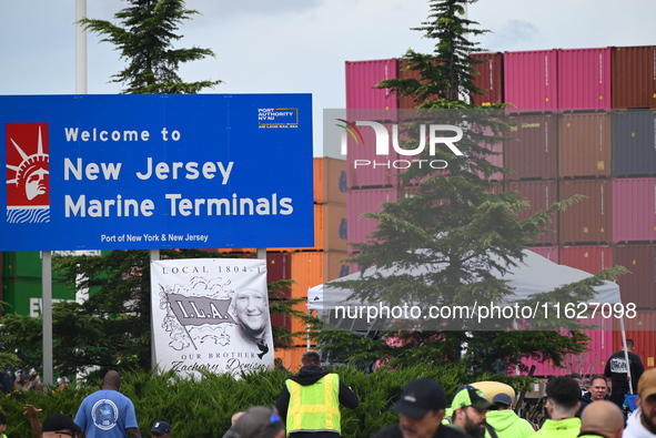 Longshoremen carry signs and demonstrate outside the APM terminals in Elizabeth, New Jersey, United States, on October 1, 2024, as members o...