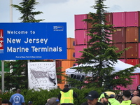 Longshoremen carry signs and demonstrate outside the APM terminals in Elizabeth, New Jersey, United States, on October 1, 2024, as members o...