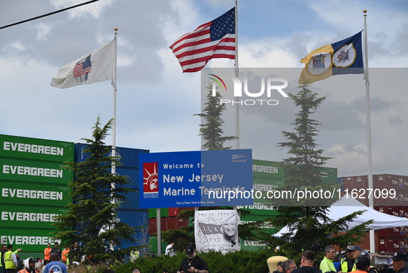 Longshoremen carry signs and demonstrate outside the APM terminals in Elizabeth, New Jersey, United States, on October 1, 2024, as members o...