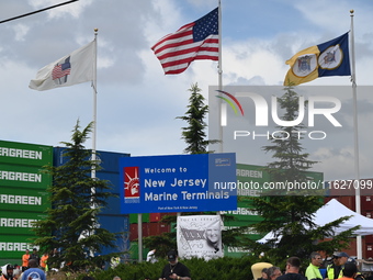 Longshoremen carry signs and demonstrate outside the APM terminals in Elizabeth, New Jersey, United States, on October 1, 2024, as members o...