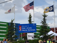 Longshoremen carry signs and demonstrate outside the APM terminals in Elizabeth, New Jersey, United States, on October 1, 2024, as members o...