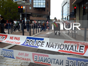 A ribbon reads 'national police'. Between 3,000 and 5,000 protesters march in Toulouse, France, on October 1, 2024, called by the FSU, the C...