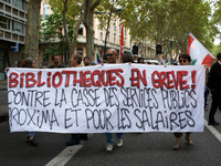 The banner reads 'Angry librarians, against the destruction of public services'. Between 3,000 and 5,000 protesters march in Toulouse, Franc...