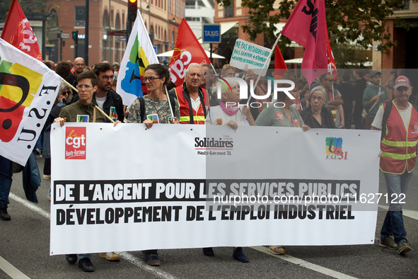 The banner reads 'Money for public services, for industrial jobs'. Between 3,000 and 5,000 protesters march in Toulouse, France, on October...