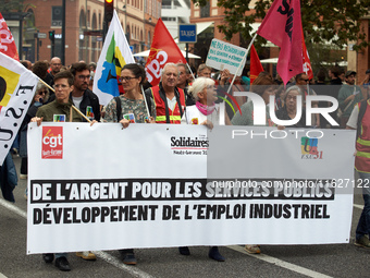 The banner reads 'Money for public services, for industrial jobs'. Between 3,000 and 5,000 protesters march in Toulouse, France, on October...