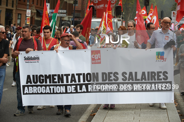 The banner reads 'raise of wages, withdrawal of the retirement reform'. Between 3,000 and 5,000 protesters march in Toulouse, France, on Oct...