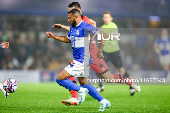 #14, Keshi Anderson of Birmingham races forward with #4, Matty Pearson of Huddersfield on his shoulder during the Sky Bet League 1 match bet...