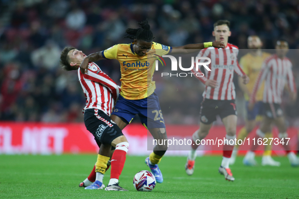 Derby County's Tawanda Chirewa elbows Sunderland's Dan Neil in the face during the Sky Bet Championship match between Sunderland and Derby C...