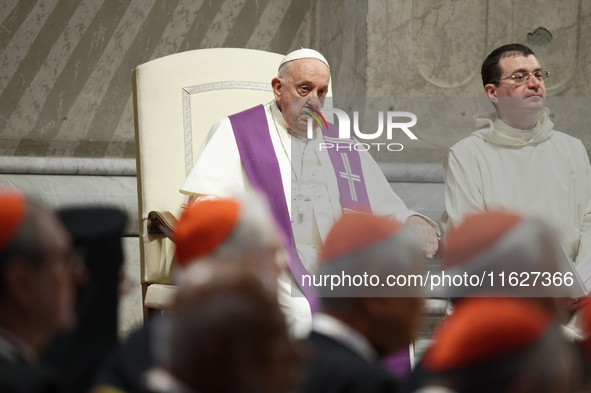 Pope Francis attends a vigil prayer in St. Peter's Basilica ahead of the start of the Synod of Bishops 16th General Assembly, at the Vatican...