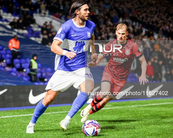 #18, Willum Por Willumsson of Birmingham is chased by #2, Lasse Sorensen of Huddersfield during the Sky Bet League 1 match between Birmingha...