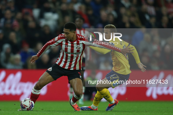 Sunderland's Jobe Bellingham holds off Derby County's Kenzo Goudmijn during the Sky Bet Championship match between Sunderland and Derby Coun...