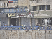 An apartment block lies in partial ruins after being hit by an Israeli airstrike in Beirut, Lebanon, on October 1, 2024. After escalating st...