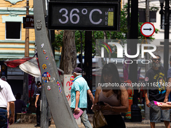 A street thermometer registers 36oC in the central region of Sao Paulo, Brazil, on October 1, 2024. (