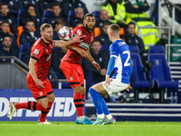 #32, Tom Lees, and #17, Brodie Spencer of Huddersfield battle for possession with #28, Jay Stansfield of Birmingham during the Sky Bet Leagu...