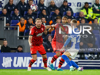 #32, Tom Lees, and #17, Brodie Spencer of Huddersfield battle for possession with #28, Jay Stansfield of Birmingham during the Sky Bet Leagu...