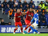 #32, Tom Lees, and #17, Brodie Spencer of Huddersfield battle for possession with #28, Jay Stansfield of Birmingham during the Sky Bet Leagu...