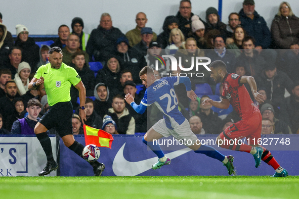 #28, Jay Stansfield of Birmingham races forward chased by #17, Brodie Spencer of Huddersfield during the Sky Bet League 1 match between Birm...