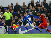 #28, Jay Stansfield of Birmingham races forward chased by #17, Brodie Spencer of Huddersfield during the Sky Bet League 1 match between Birm...