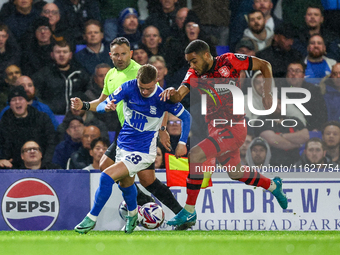 #28, Jay Stansfield of Birmingham battles with #17, Brodie Spencer of Huddersfield during the Sky Bet League 1 match between Birmingham City...