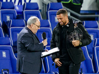 Local celebrity and bare-knuckle champion Connor Tierney (right) is interviewed at the interval during the Sky Bet League 1 match between Bi...