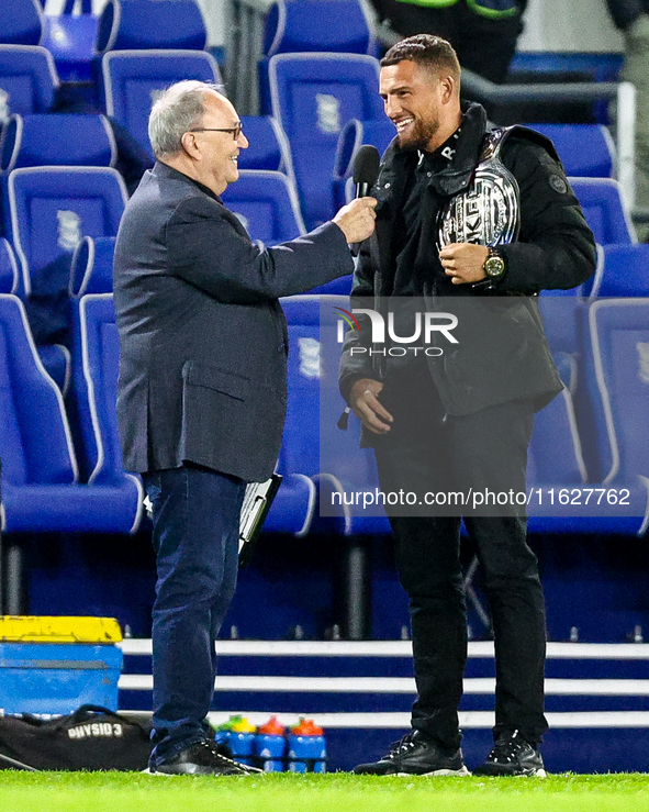 Local celebrity and bare-knuckle champion Connor Tierney (right) is interviewed at the interval during the Sky Bet League 1 match between Bi...