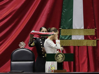 Claudia Sheinbaum (off-white dress), president of Mexico, receives the presidential sash in Mexico City, Mexico, on October 1, 2024, at the...